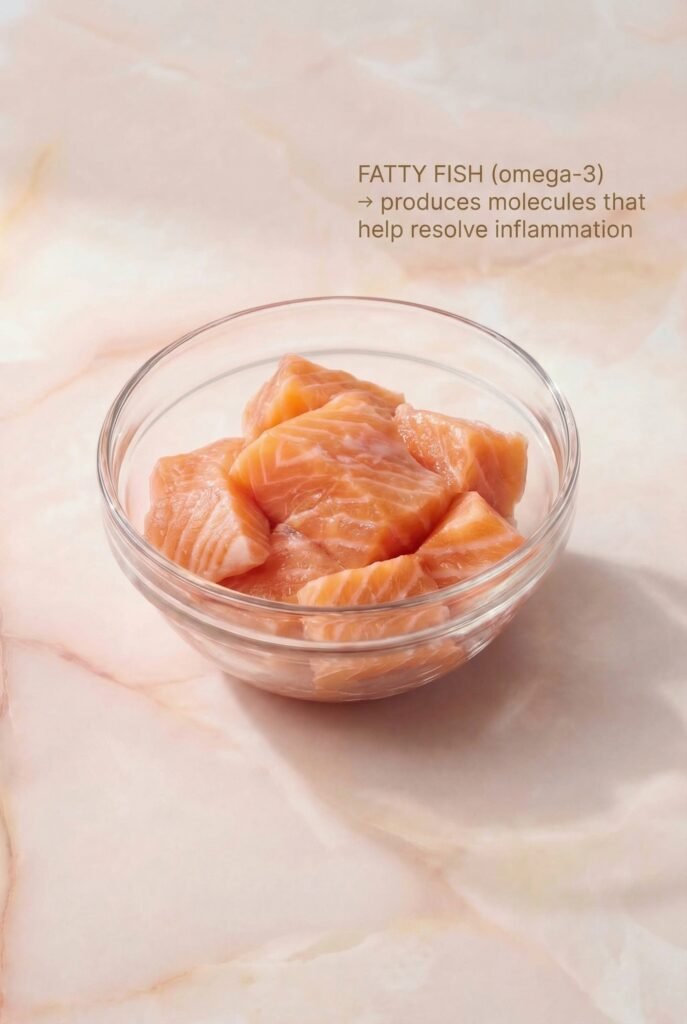Fatty fish salmon pieces in glass bowl — omega-3 anti-inflammatory food